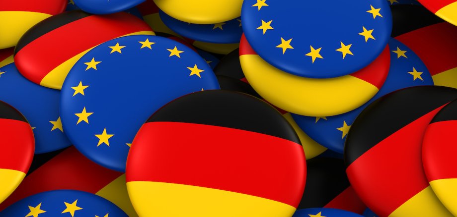 Germany and Europe Badges Background - Pile of German and European Flag Buttons 3D Illustration